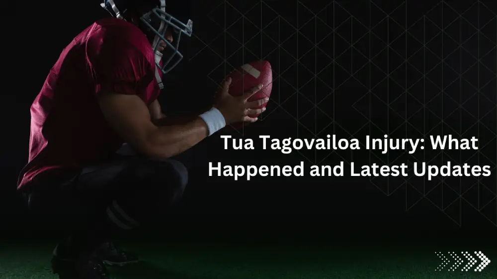 American football player crouching, holding football.